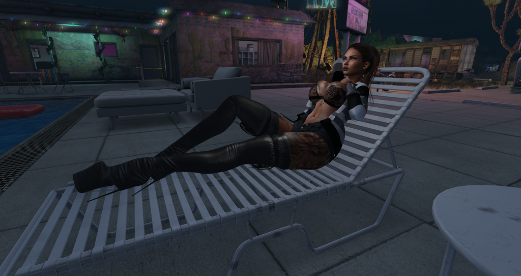 Daria lounging poolside at a shit-rated location in her Best Motels in Second Life list